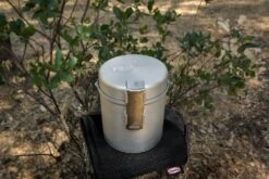 Primus Essential Trail Kit -Sierra Designs Shop stove on top of protective bag top view